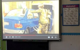 A dim projector in a classroom.